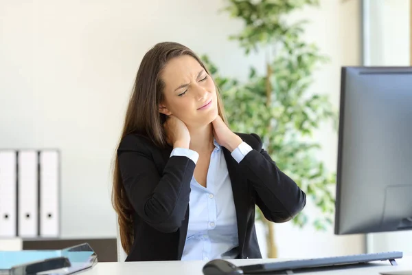 Businesswoman suffering neck pain